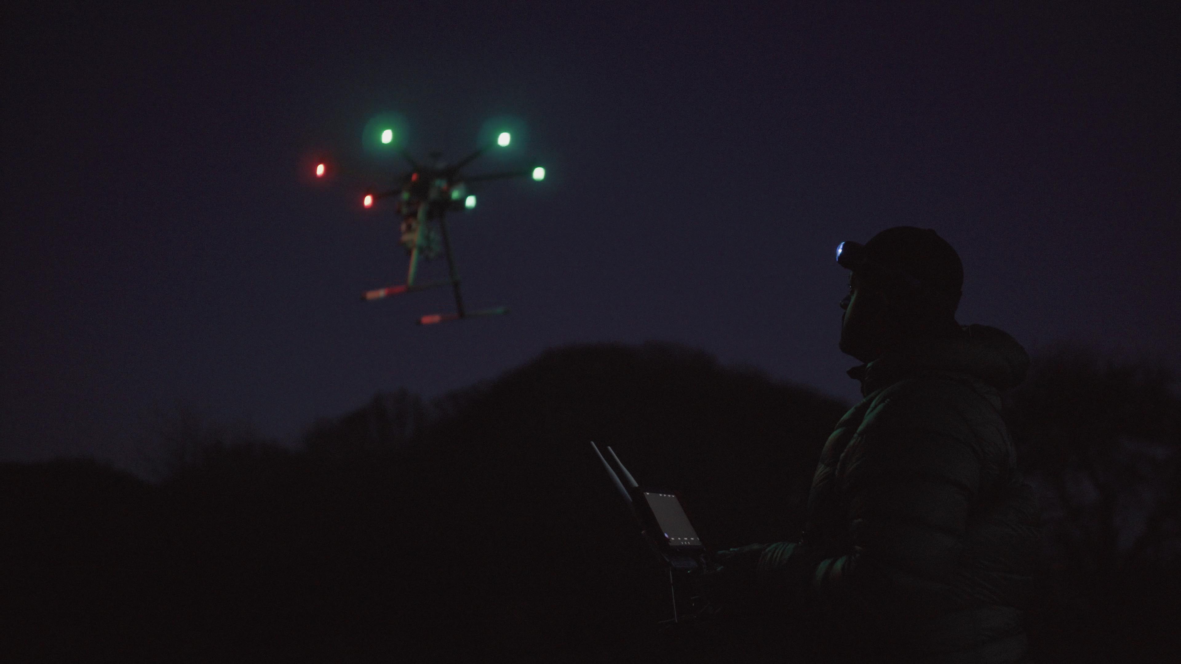 Drone pilot with headlamp Professional drone pilot working on a dark morning with his S4 headlamp