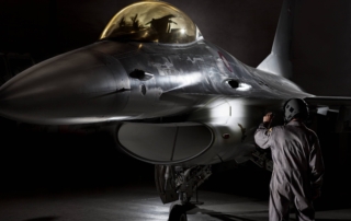 F16 fighter pilot F16 fighter pilot inspecting his airplane with professional Suprabeam flashlight