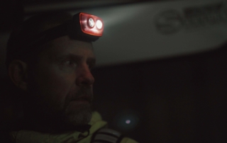 Kayaker with headlamp Kayaker sailing on a dark morning with his Suprabeam S3 headlamp