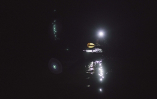 Kayaker with headlamp Kayaker sailing on a dark morning with his Suprabeam S3 headlamp