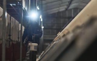 Electrician with helmet mounted headlamp Electrician working on a construction site, with a S4 rechargeable headlamp mounted on his safety helmet