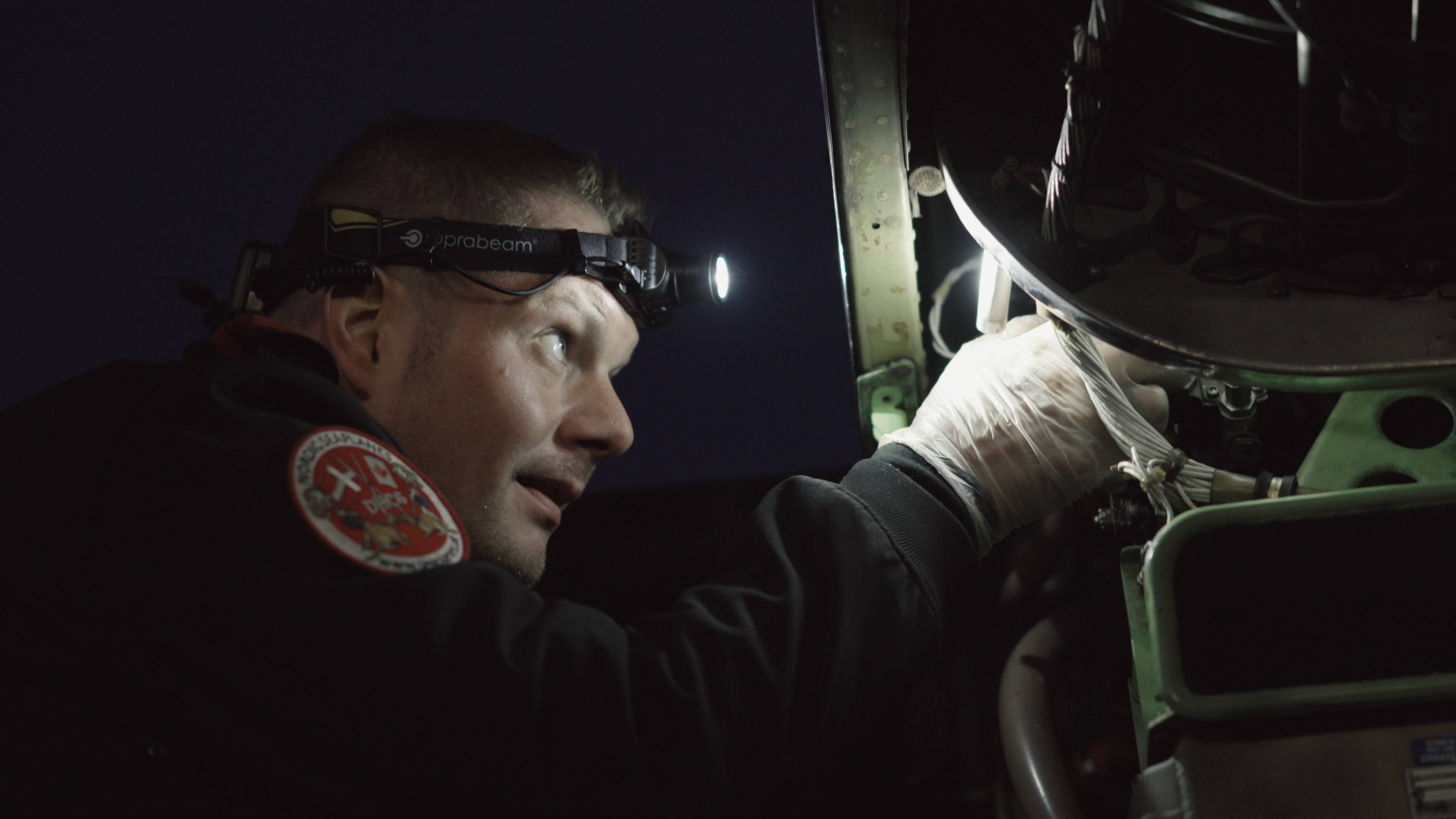 Seaplane mechanic 1 Flight mechanic inspecting seaplane before take off using the V3pro rechargeable headlamp