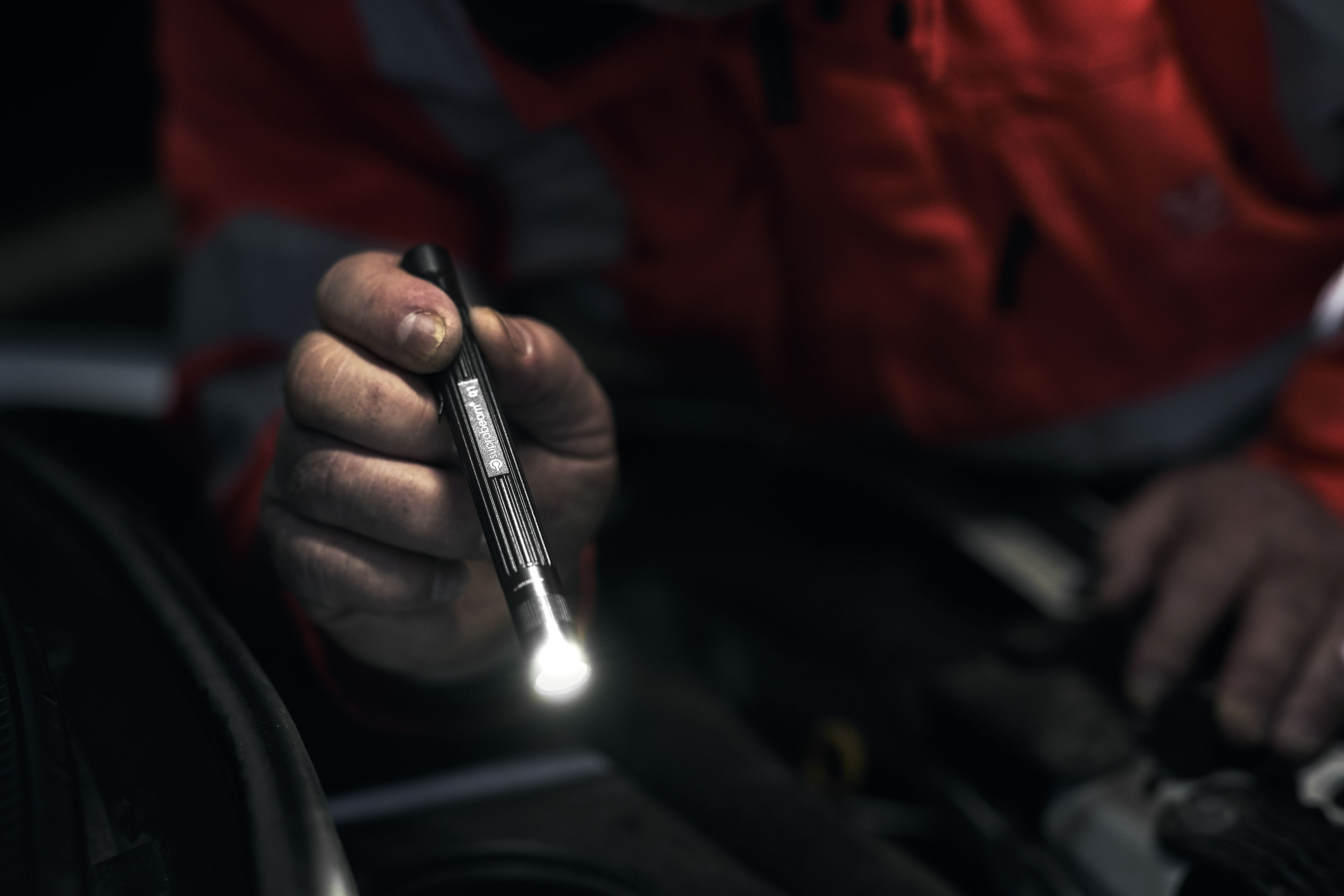 roadside_assistance_14 Roadside assistance officer working with headlamp