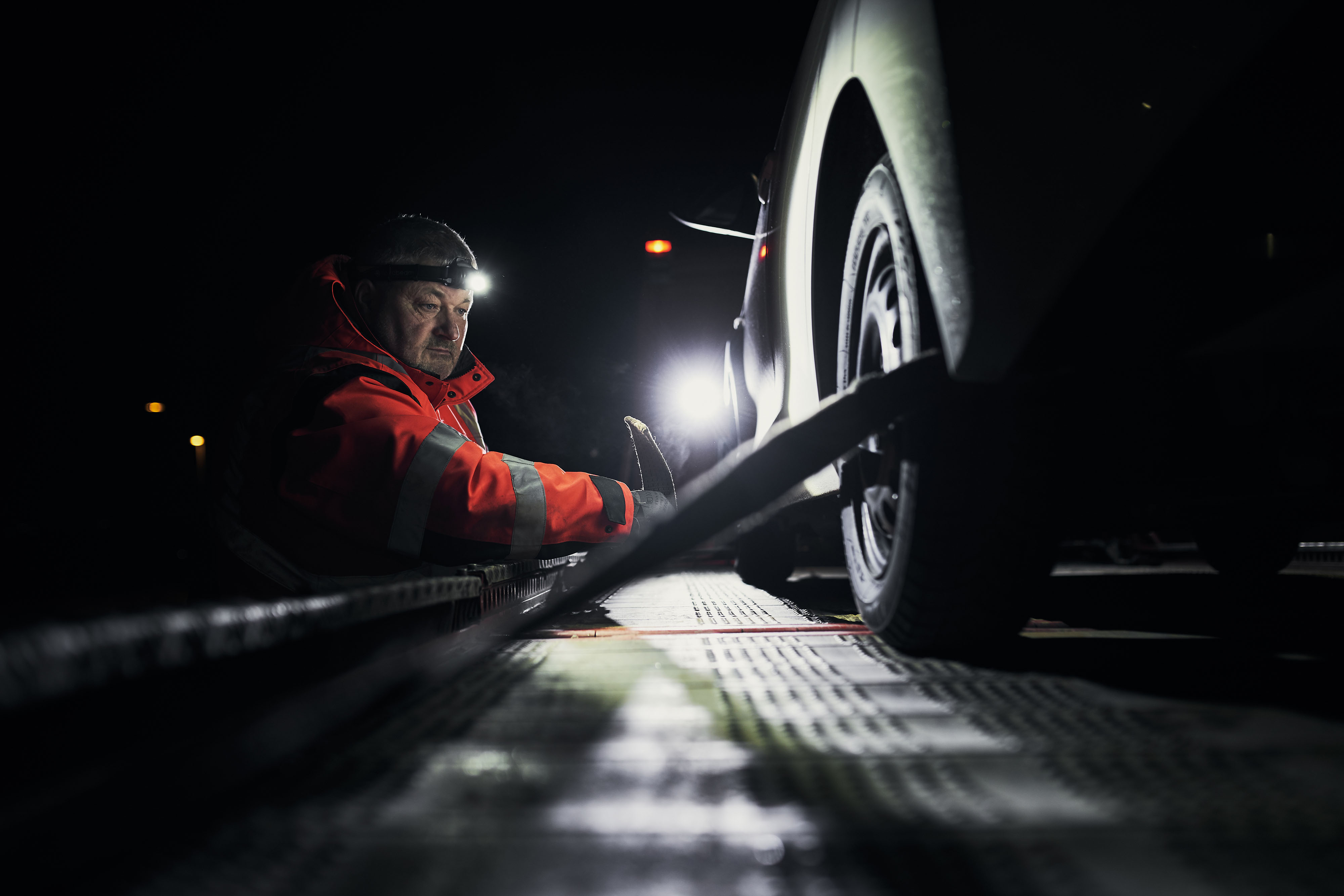 roadside_assistance_3 Roadside assistance offier working with headlamp