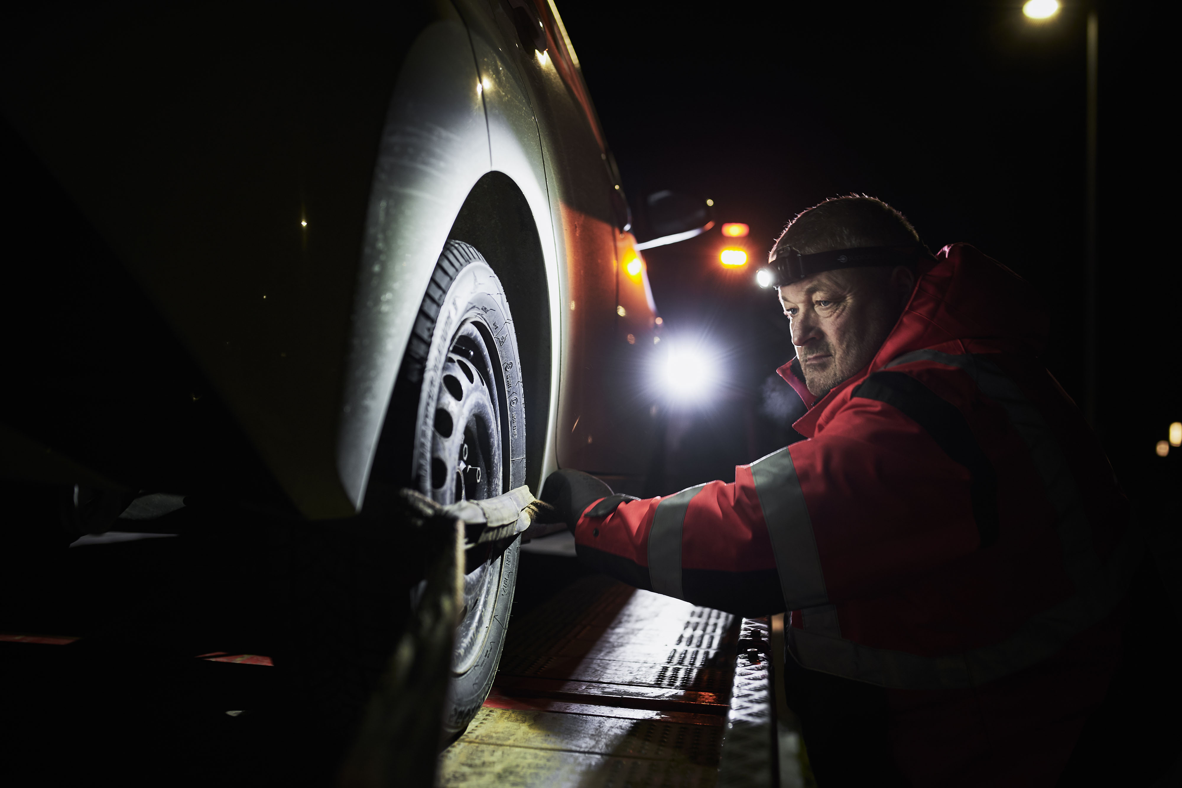 roadside_assistance_5 Roadside assistance offier working with headlamp