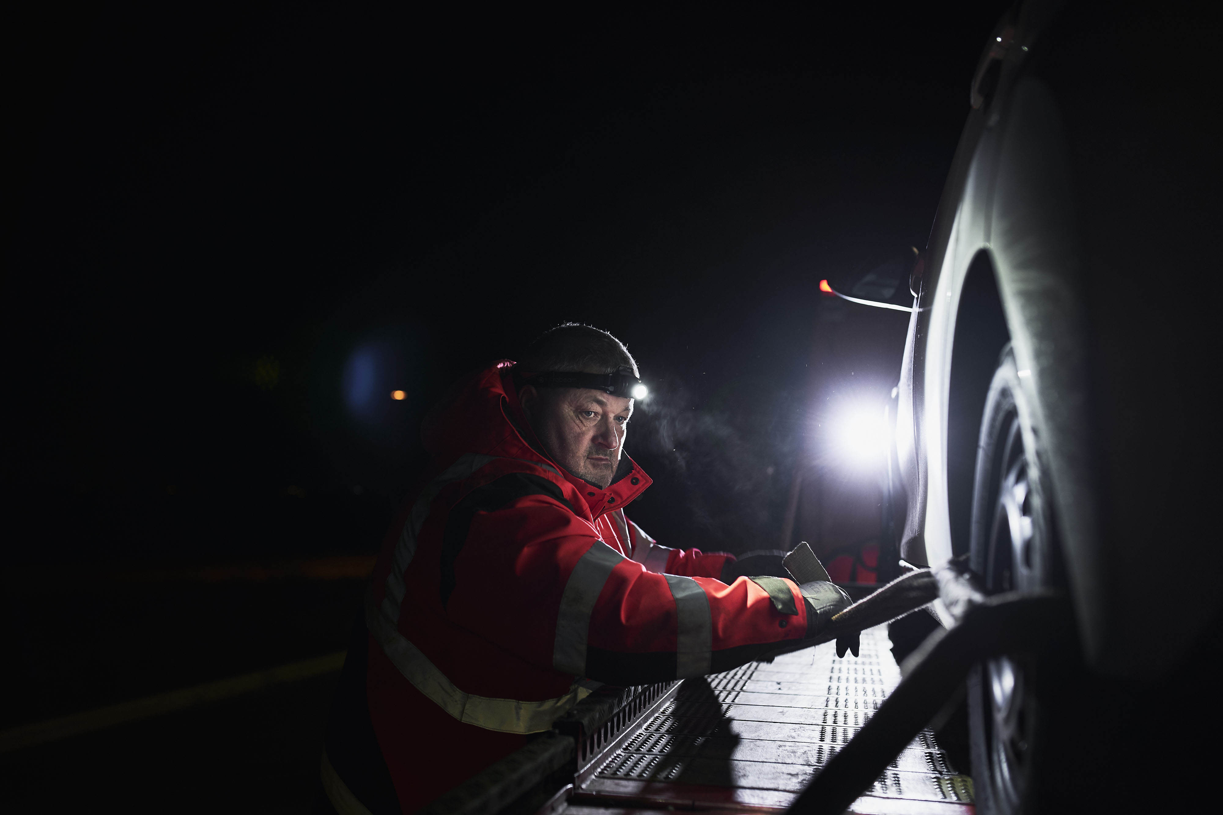 roadside_assistance_7 Roadside assistance officer working with headlamp
